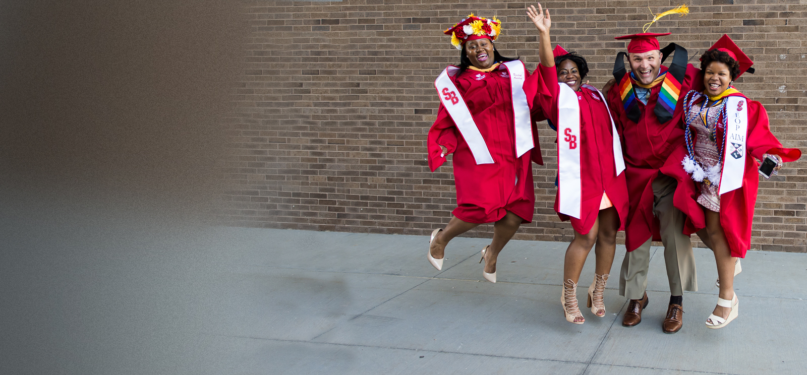 Graduation students jumping for joy